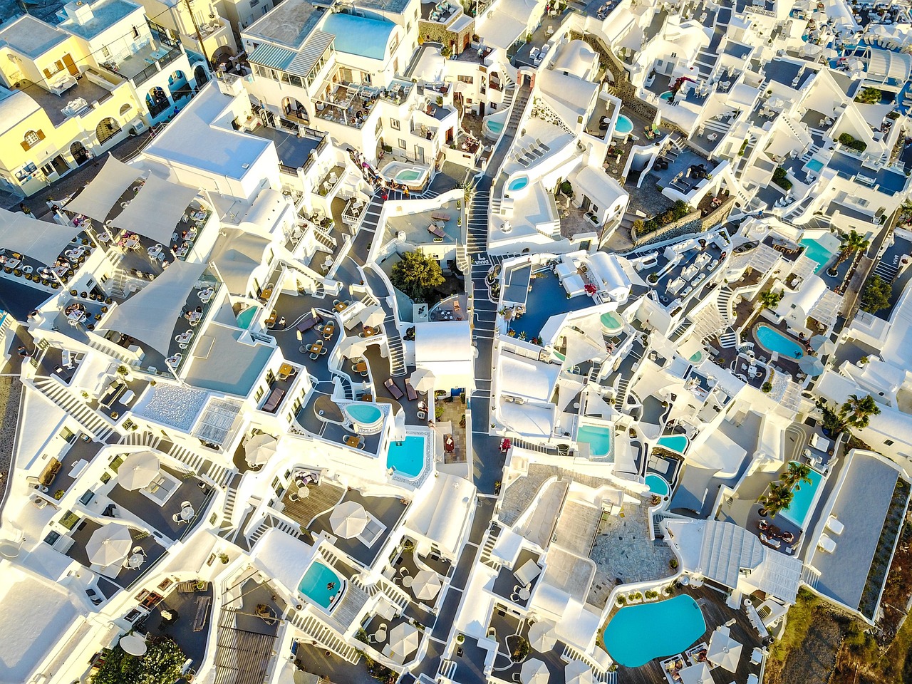 Aerial view of a luxury waterfront home in South Florida with a pool.