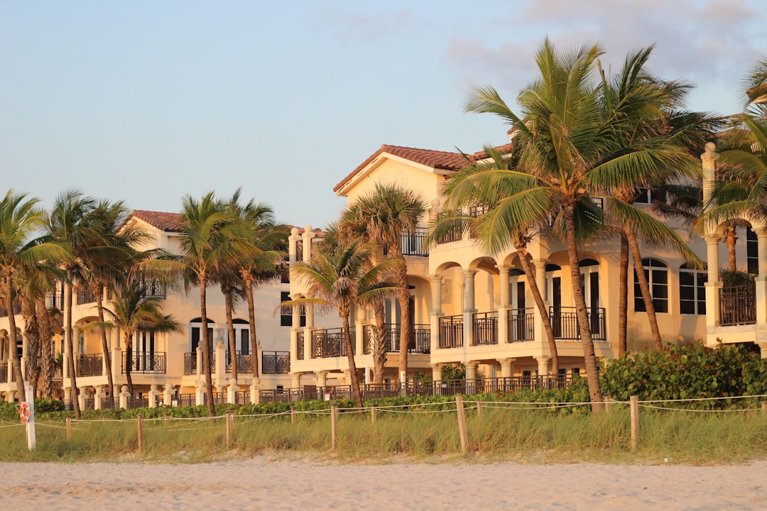 Hurricane-rated impact windows on a Florida luxury home, a key wind mitigation feature.