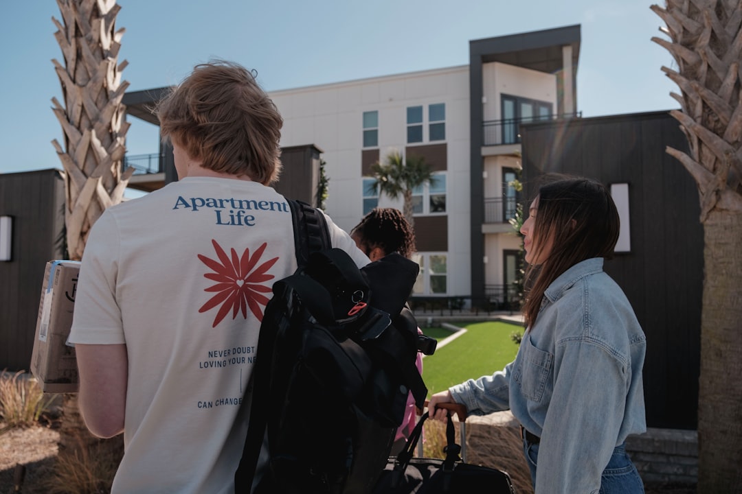Property inspector examining the exterior of a multifamily apartment building in Florida.