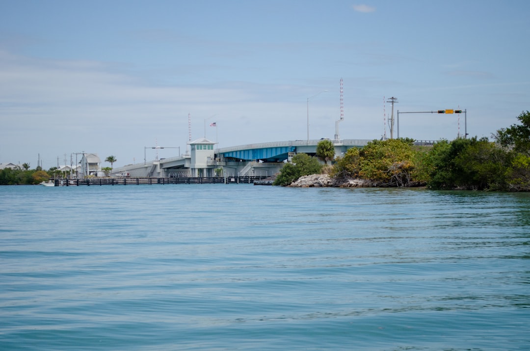 Boat navigating a South Florida Intracoastal Waterway canal illustrating water access for waterfront properties.
