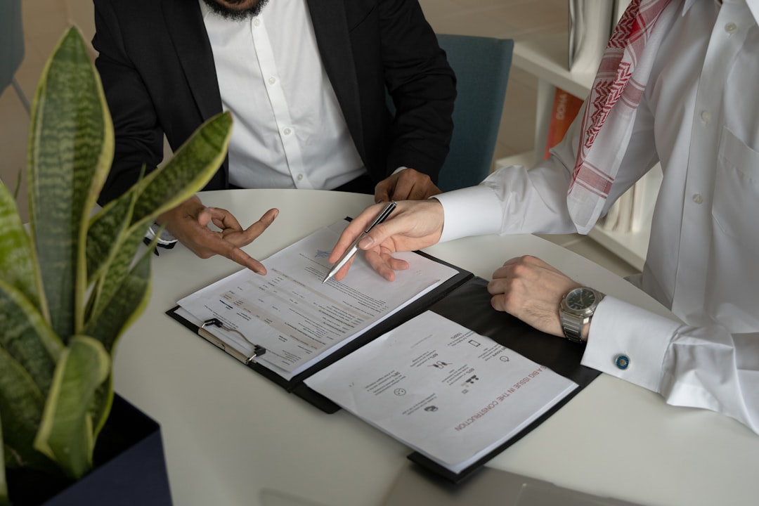 Buyer signing mortgage documents during a luxury home closing in Florida.