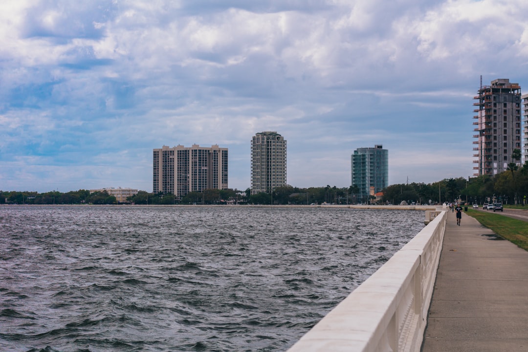 South Florida luxury condominium building with pool deck and waterfront access.