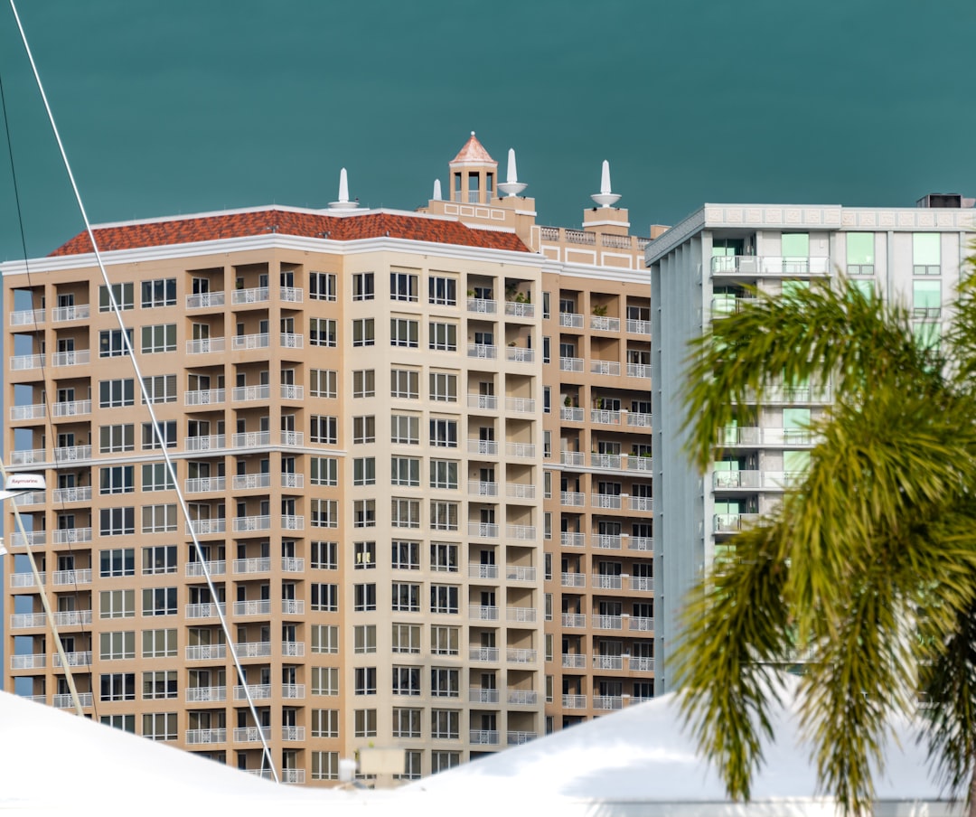Luxury condo buyer reviewing real estate documents before closing in Florida.