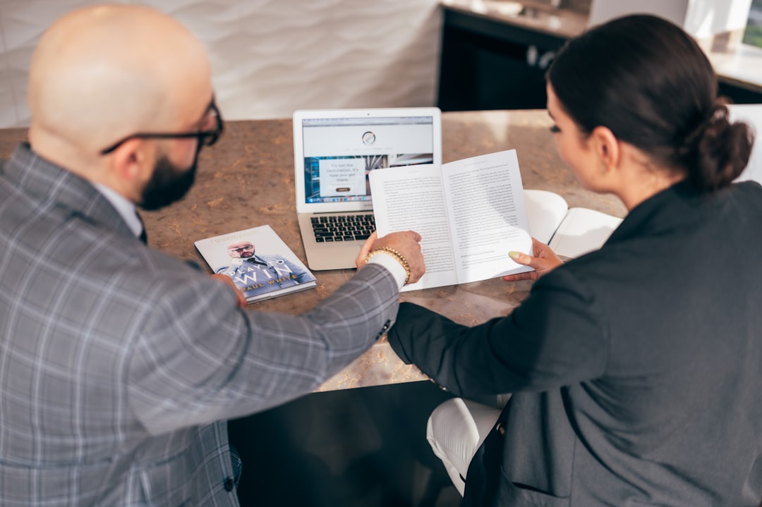 Real estate professional reviewing pricing data and market analysis for a luxury South Florida property.
