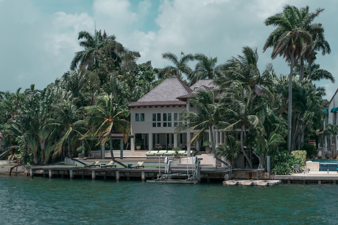 Homeowner reviewing insurance policy documents for a South Florida luxury property.