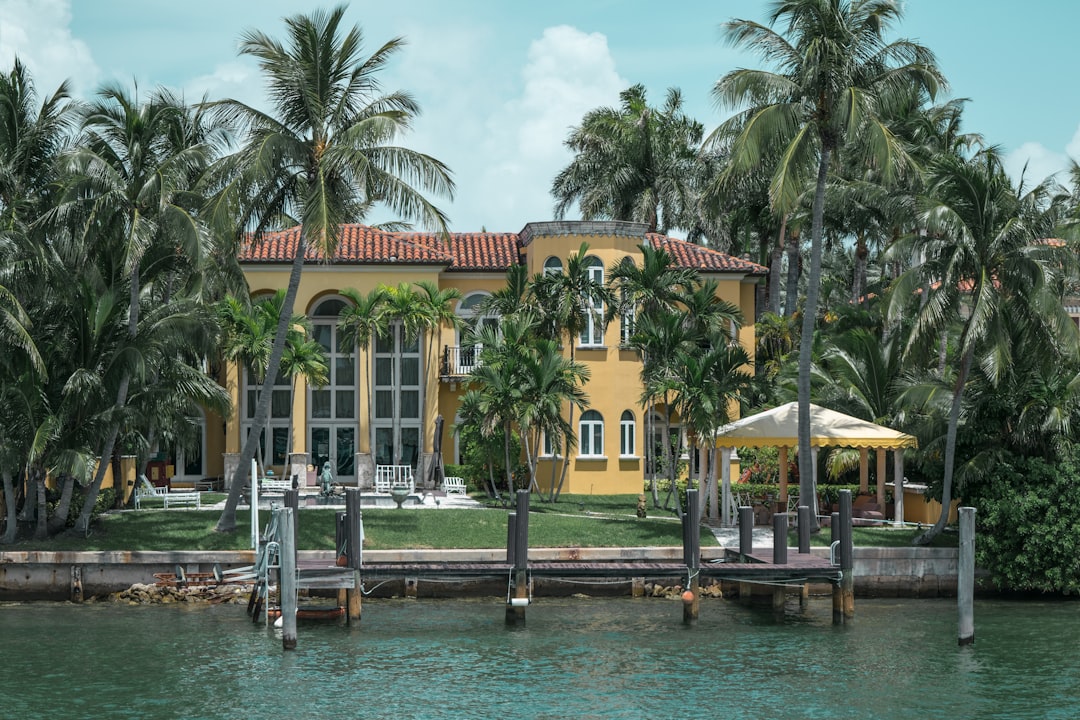 Luxury Florida home with hurricane shutters closed and exterior secured before off-season.