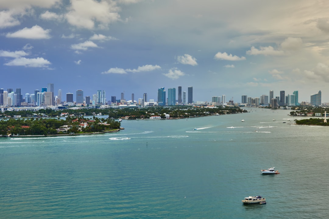 Aerial view of Miami Beach luxury oceanfront condominium towers along the Atlantic coast.