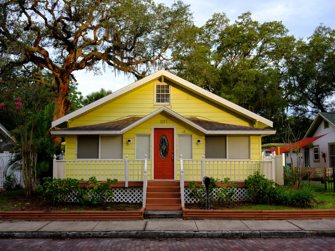 Home inspector examining the exterior of a luxury South Florida property.