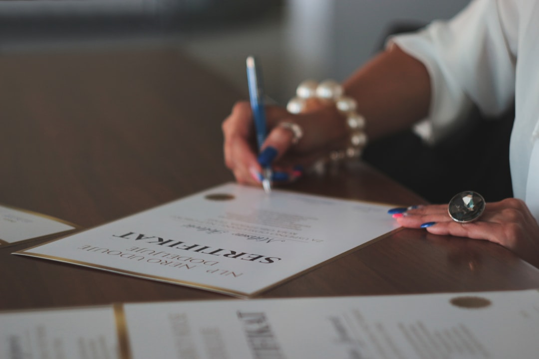 Luxury home seller reviewing closing documents with a real estate attorney in Florida.