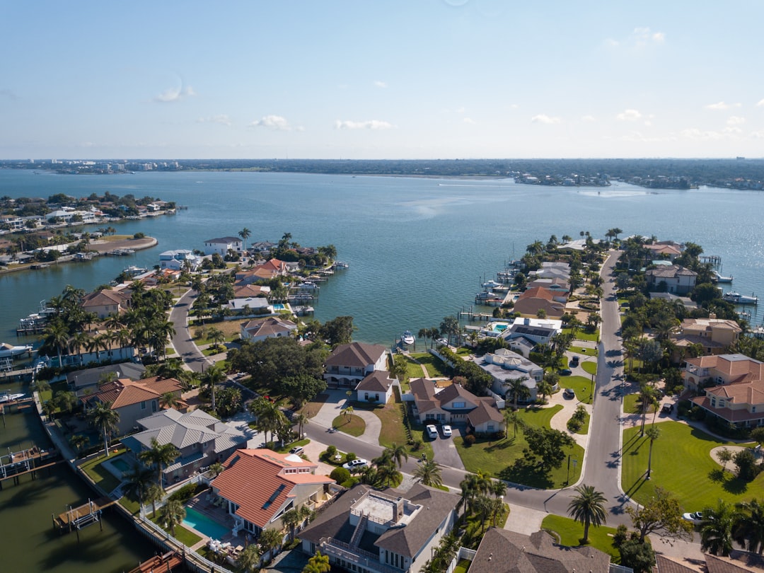 Real estate attorney and CPA meeting with luxury home seller for pre-sale tax planning in Florida.