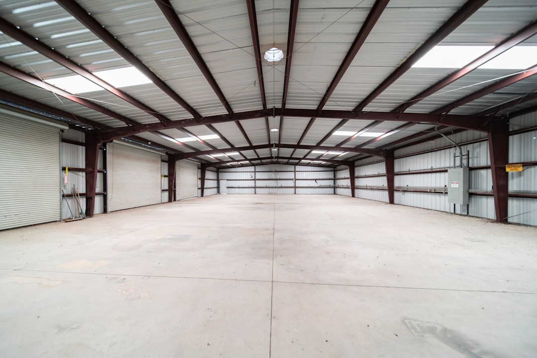 Commercial real estate broker showing an industrial warehouse property to investors.
