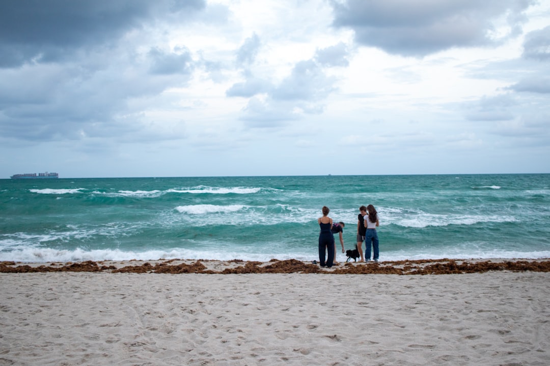 Real estate agent meeting with sellers at a luxury South Florida estate.