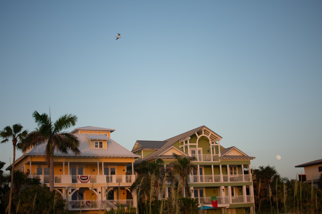 Home inspector evaluating the roof and structure of a luxury Florida property.