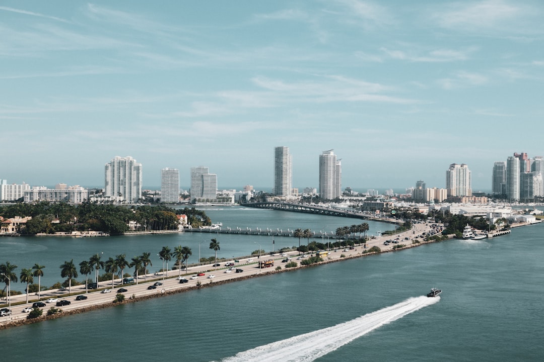 Aerial view of Miami skyline with luxury condos and waterfront investment properties.