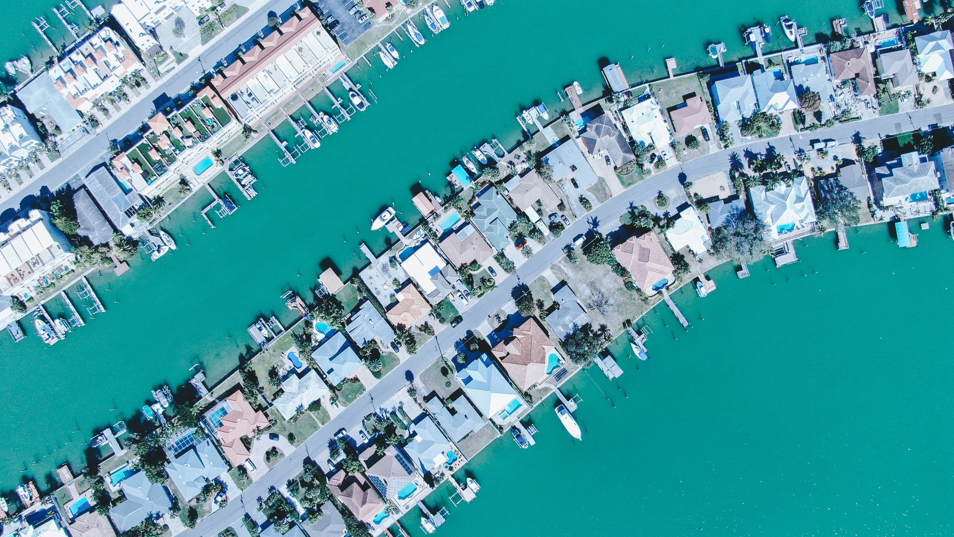 Aerial view of Florida coastal luxury homes across multiple neighborhoods and cities.