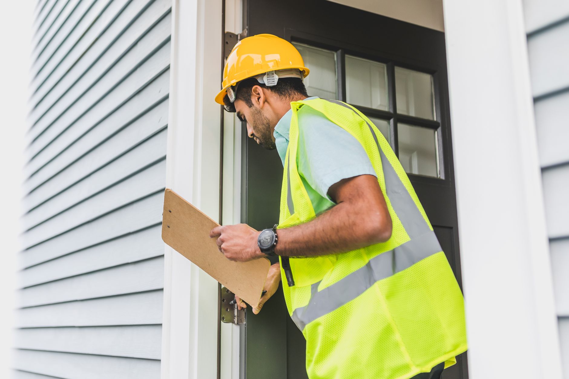 Professional home inspector examining a Florida luxury property during due diligence.