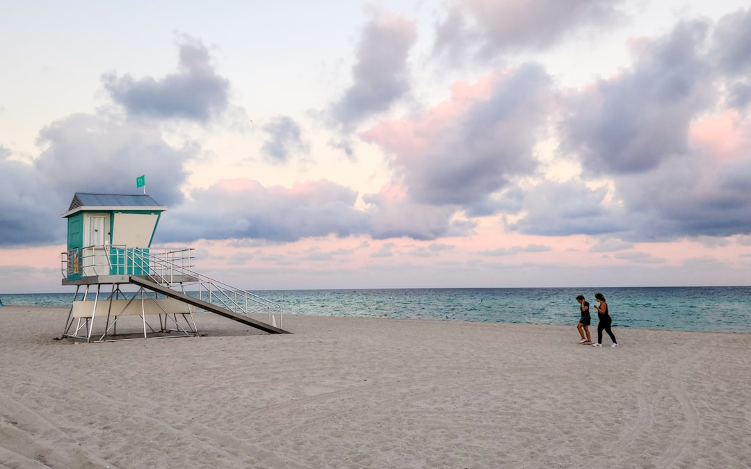 Real estate broker discussing a luxury South Florida property with prospective buyers.