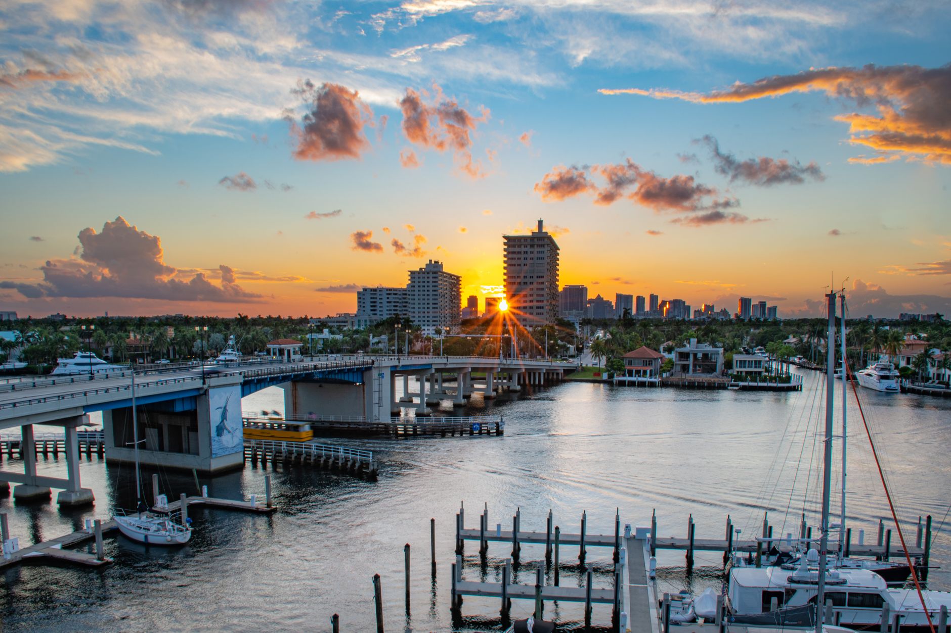 Waterfront luxury home in Fort Lauderdale with private deep-water dock and modern architecture along a canal.