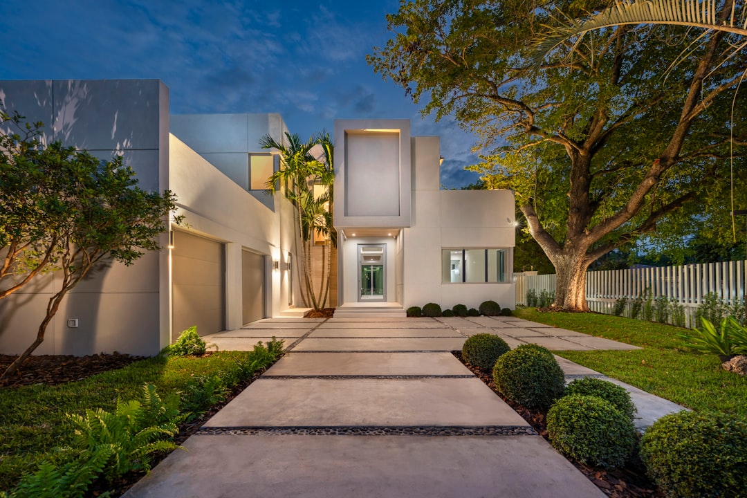 Real estate professional consulting with clients about a luxury South Florida property.
