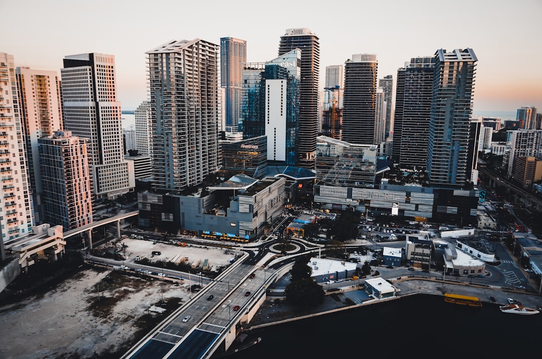 Construction cranes rise above Miami downtown as new luxury condo developments take shape.