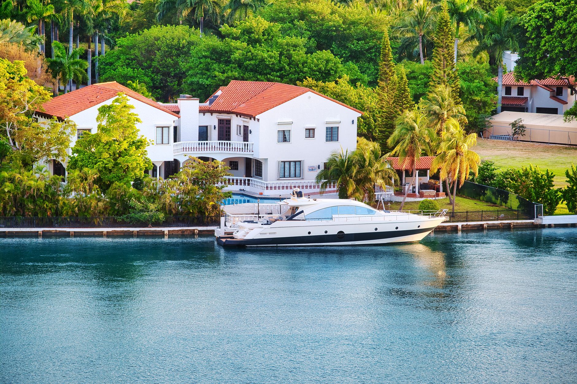 Luxury waterfront home with private dock on a Gulf-access canal in Naples, Florida.