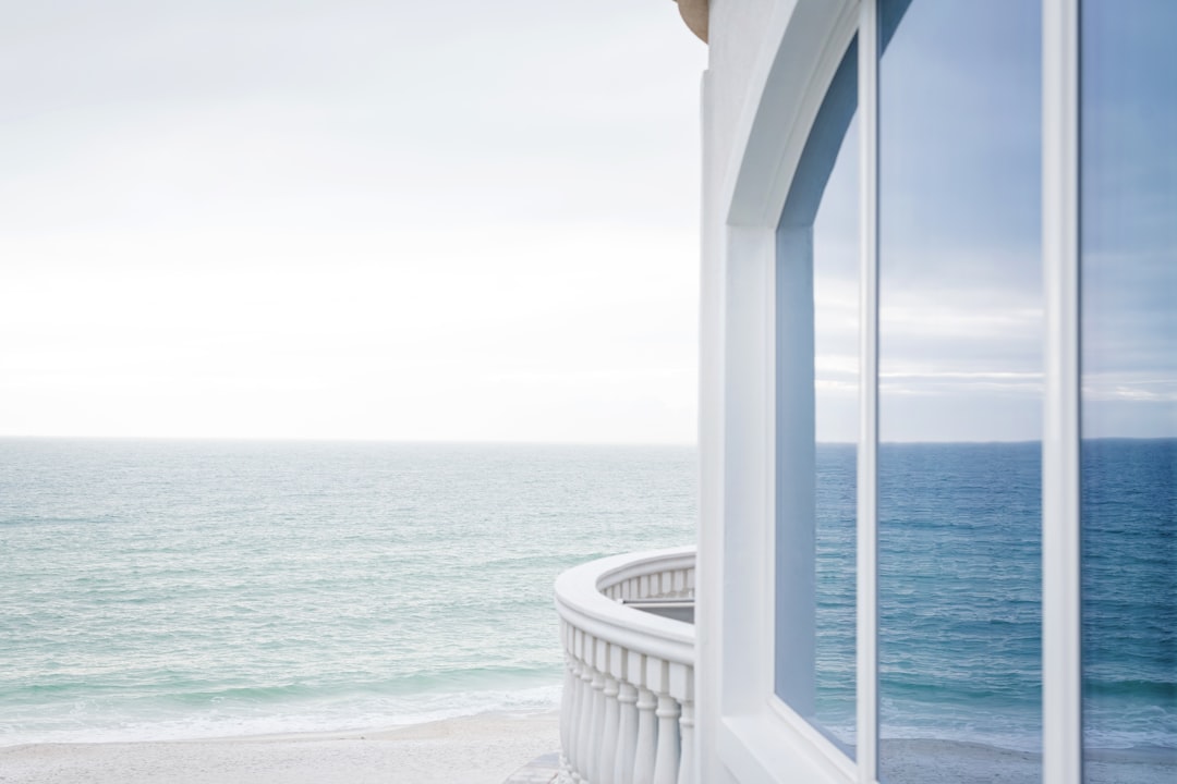 Luxury Florida condominium interior with modern living room and ocean views.