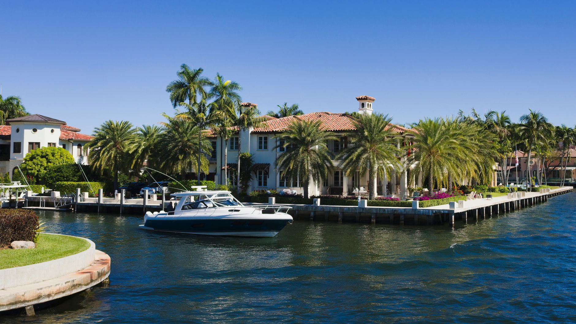 Luxury waterfront home on the Fort Lauderdale Intracoastal Waterway with private dock and boat.