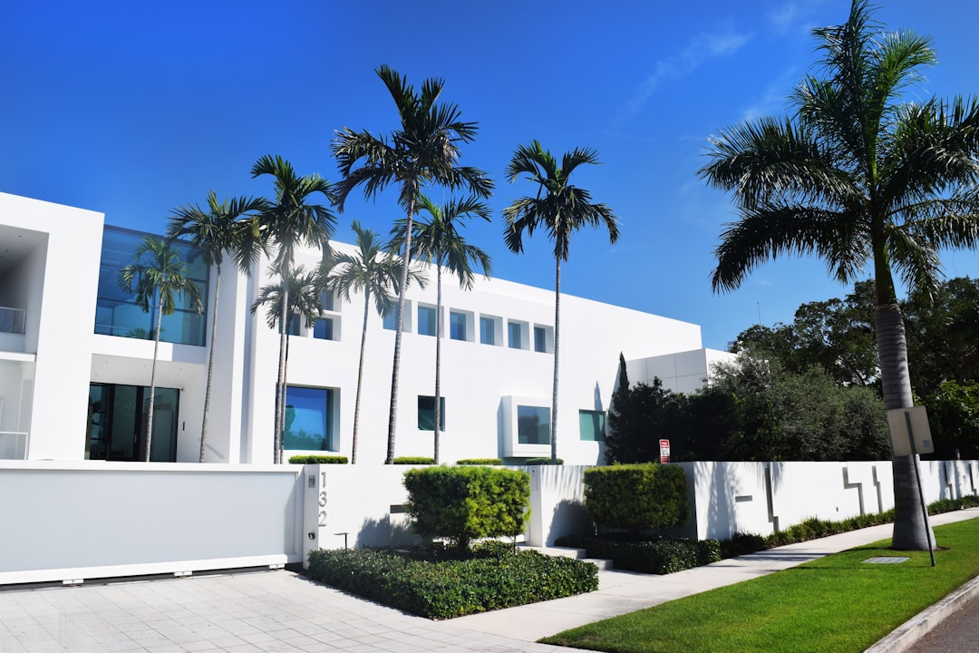 Luxury estate home with pool in a private gated golf community in South Florida.
