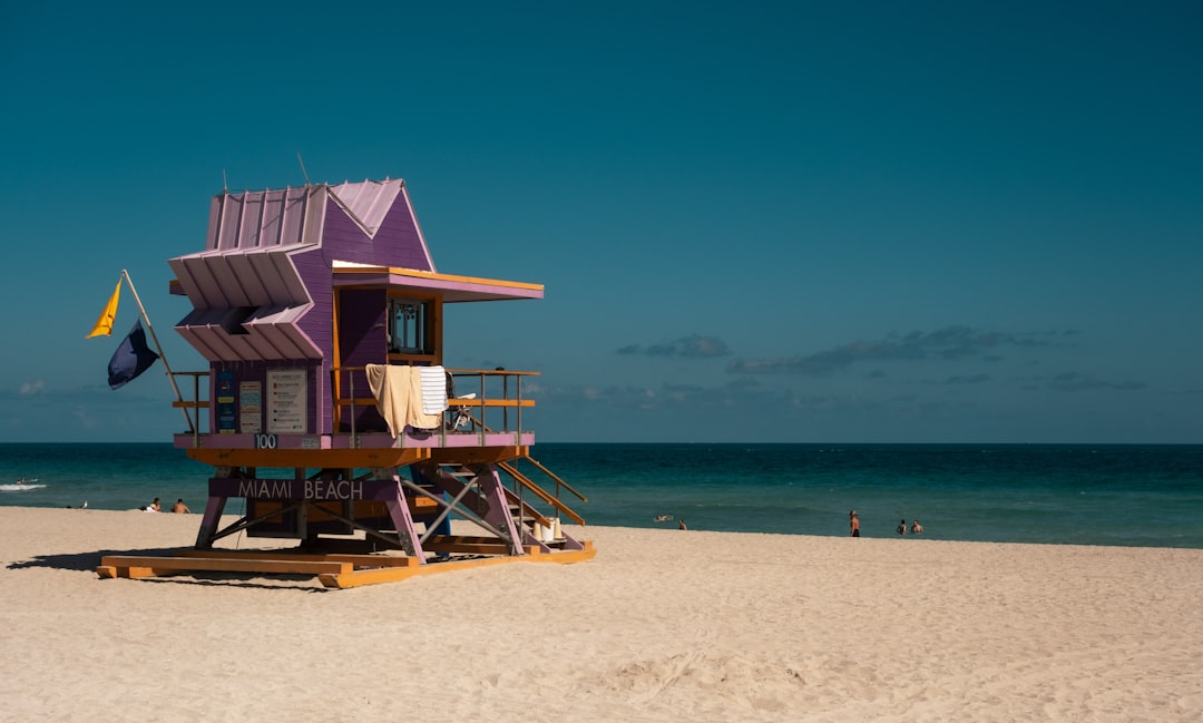 Real estate broker giving a private showing of a luxury South Florida home to a qualified buyer