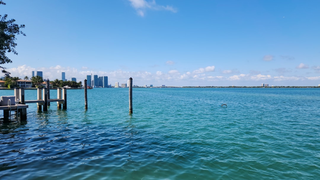 Buyers and agents signing closing documents for a Florida luxury home sale