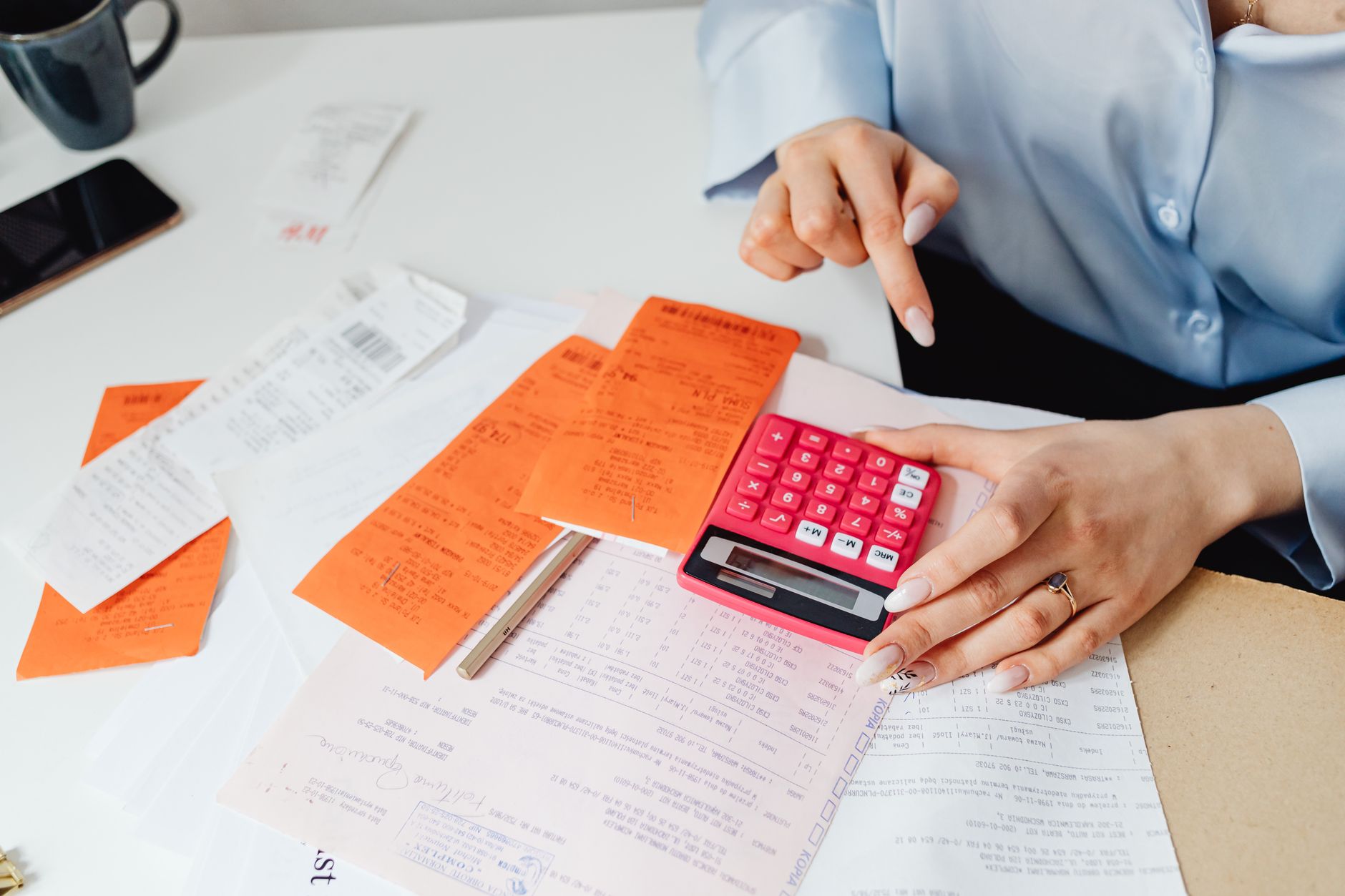 Closing cost paperwork and calculator on a desk during a Florida real estate transaction