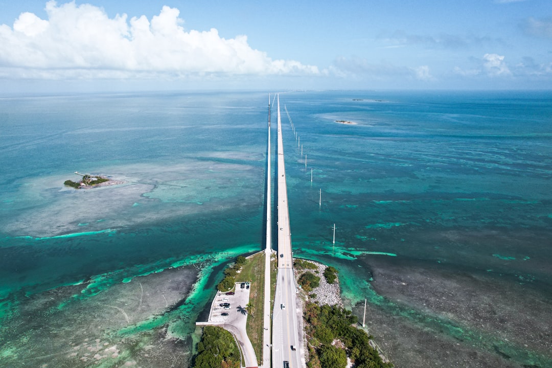 Aerial view of the Florida Keys islands and highway bridges over turquoise water.