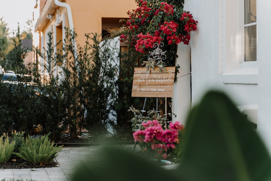 For sale sign in front of a luxury Florida home reflecting regional pricing strategy