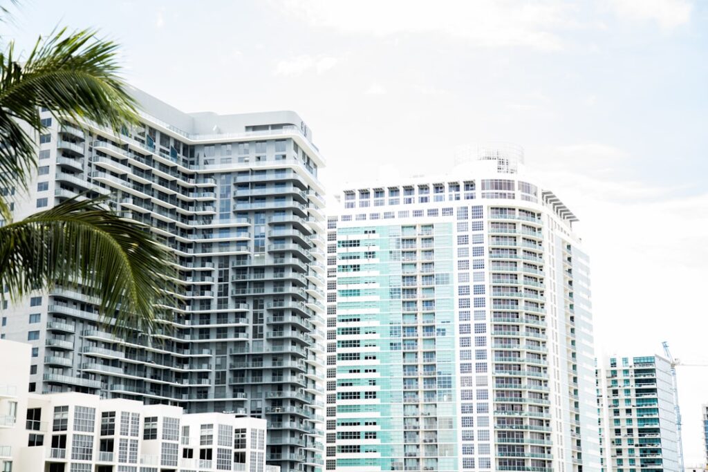 Foreign property seller signing closing documents at a Miami real estate office