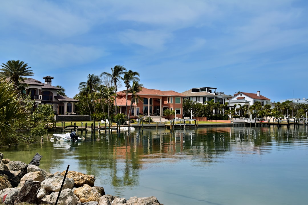A real estate broker showing a luxury waterfront property to clients on Florida's Treasure Coast