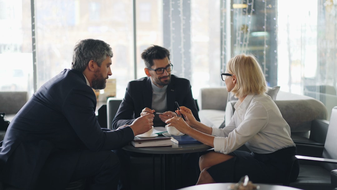 Broker reviewing condo association reserve documents with buyers in South Florida