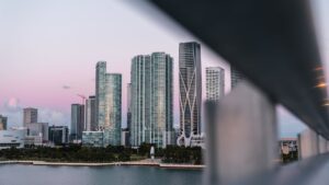 Pre-construction luxury condo tower rendering displayed in a Brickell Miami sales gallery