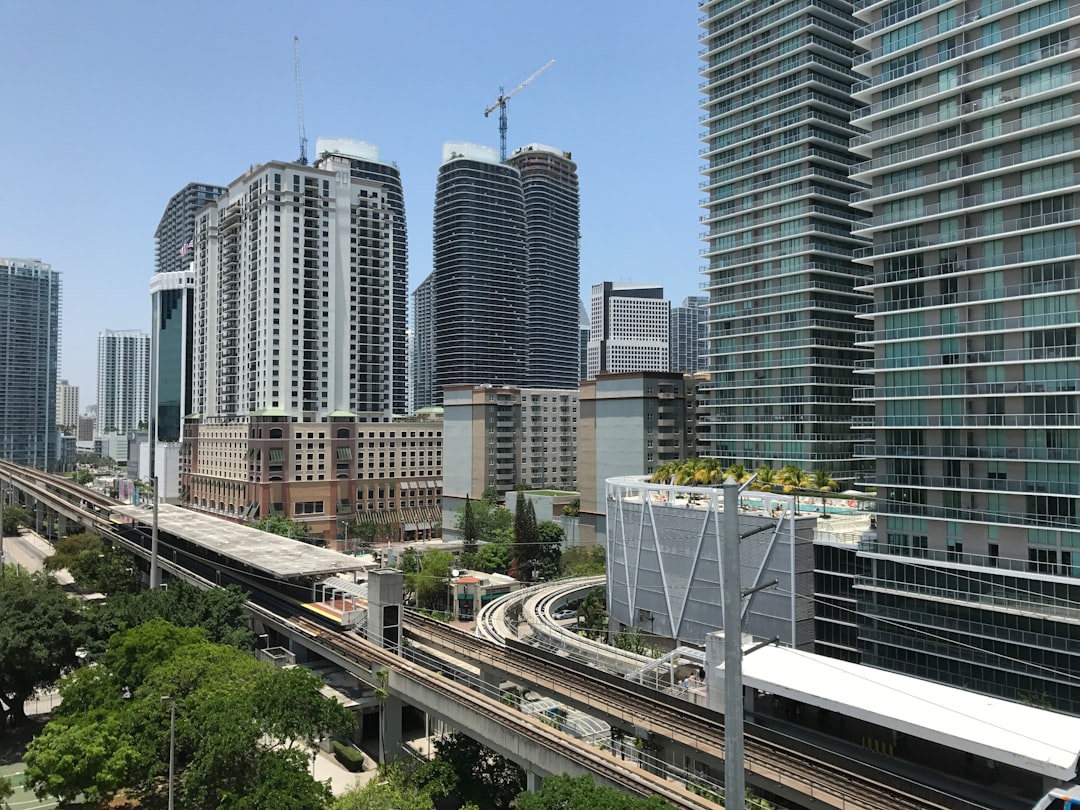 Luxury condo tower under construction in Brickell Miami with a construction crane