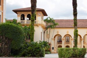 Gated luxury waterfront estate in South Florida representing real estate ownership privacy