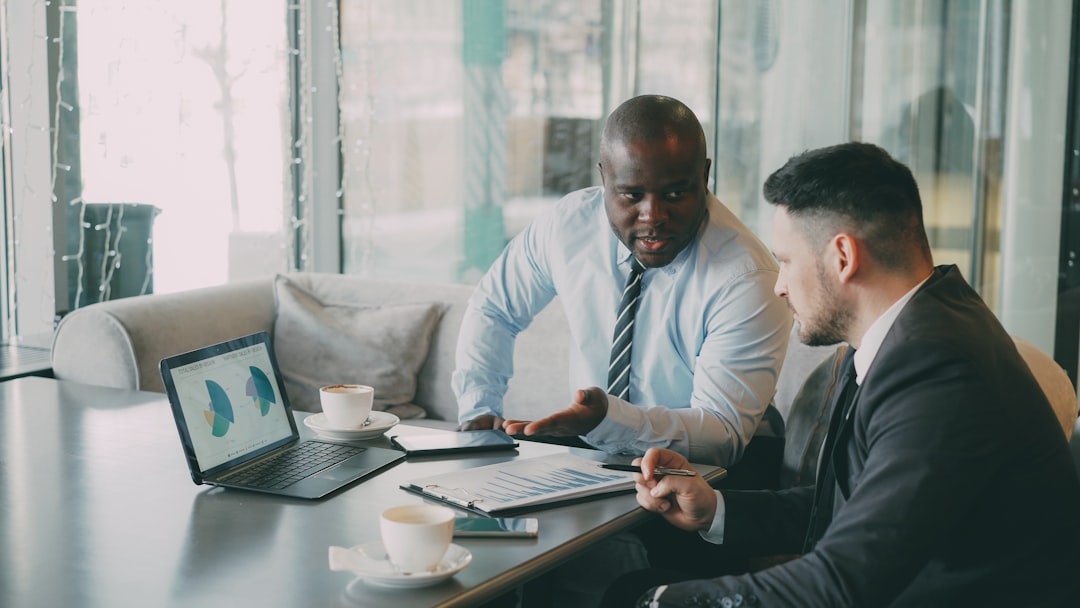 Real estate broker reviewing a commercial contract with an investor client in Florida
