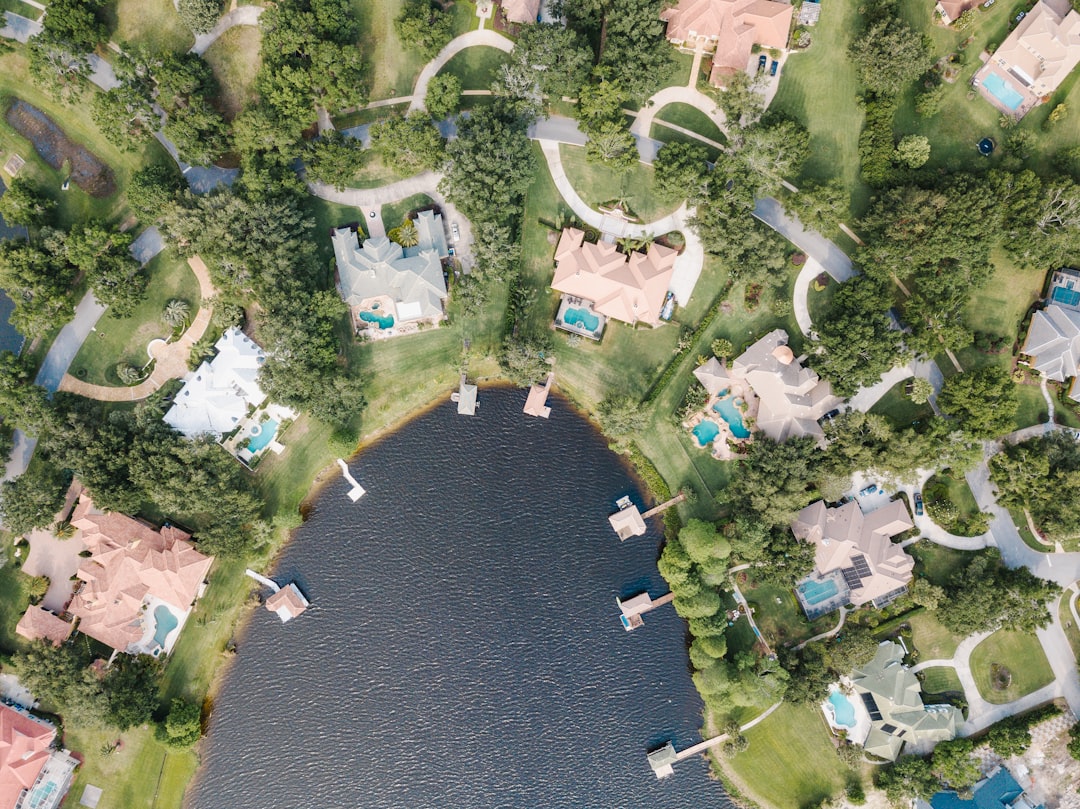 Real estate agent meeting with buyers at a waterfront Florida home before a scheduled showing
