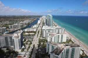 Oceanfront luxury condo towers along the Sunny Isles Beach coastline in Miami-Dade County