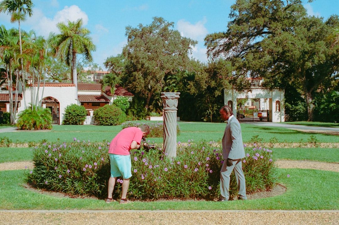 Real estate broker reviewing construction plans with clients for a Florida luxury home