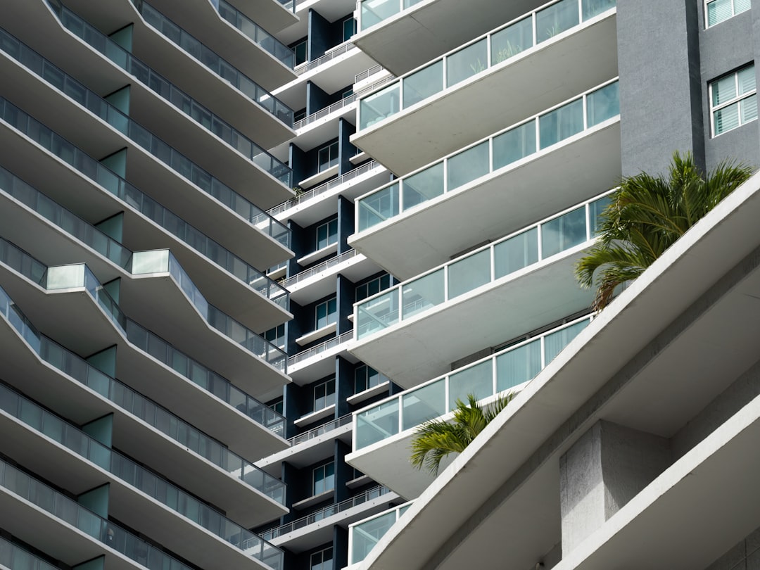 New luxury condo tower with balconies overlooking Biscayne Bay near Coconut Grove