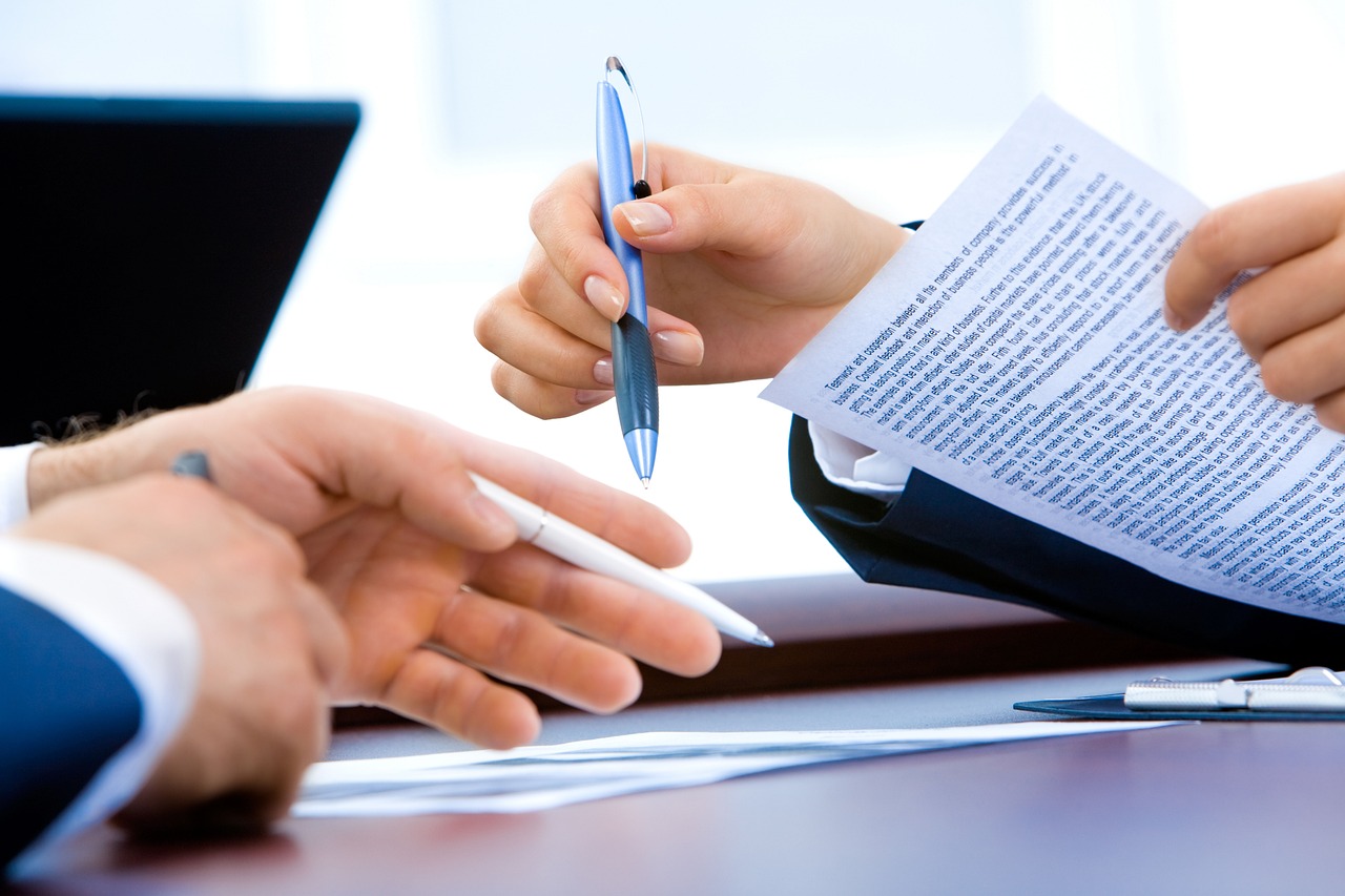 Buyer reviewing closing documents at a South Florida title company office