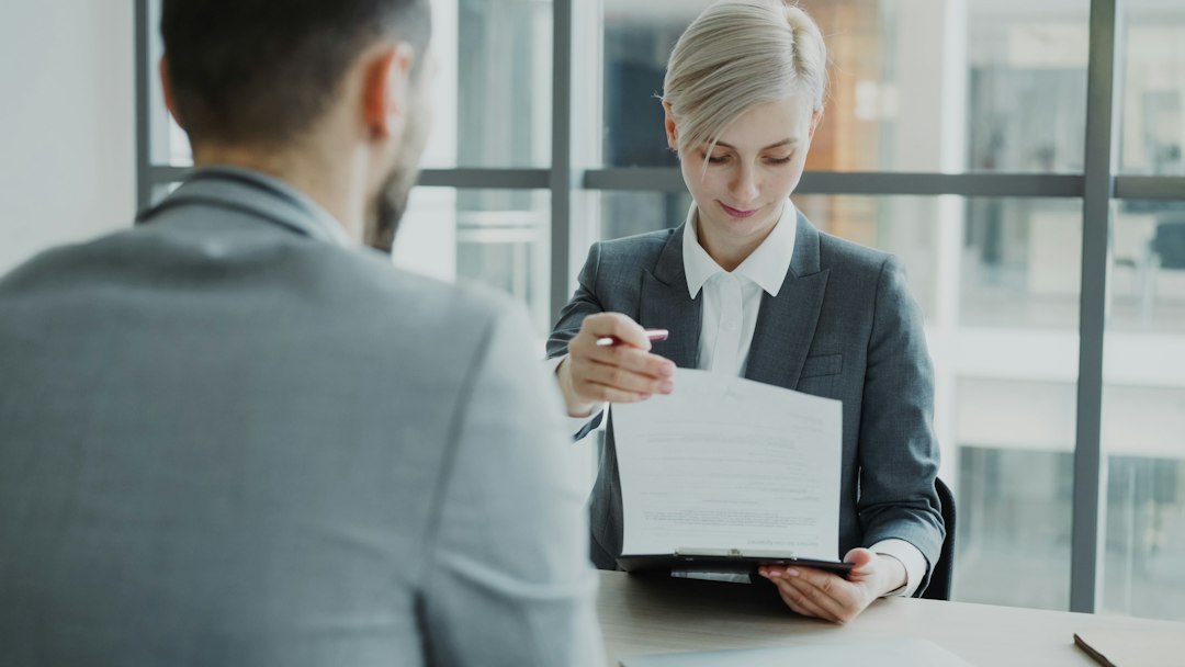 Insurance agent reviewing a Florida homeowners policy with a luxury home buyer