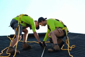 Inspector reviewing roof and electrical systems on a Florida luxury home for a four-point inspection