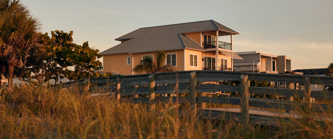Raised luxury Florida coastal home with elevated foundation relevant to flood elevation