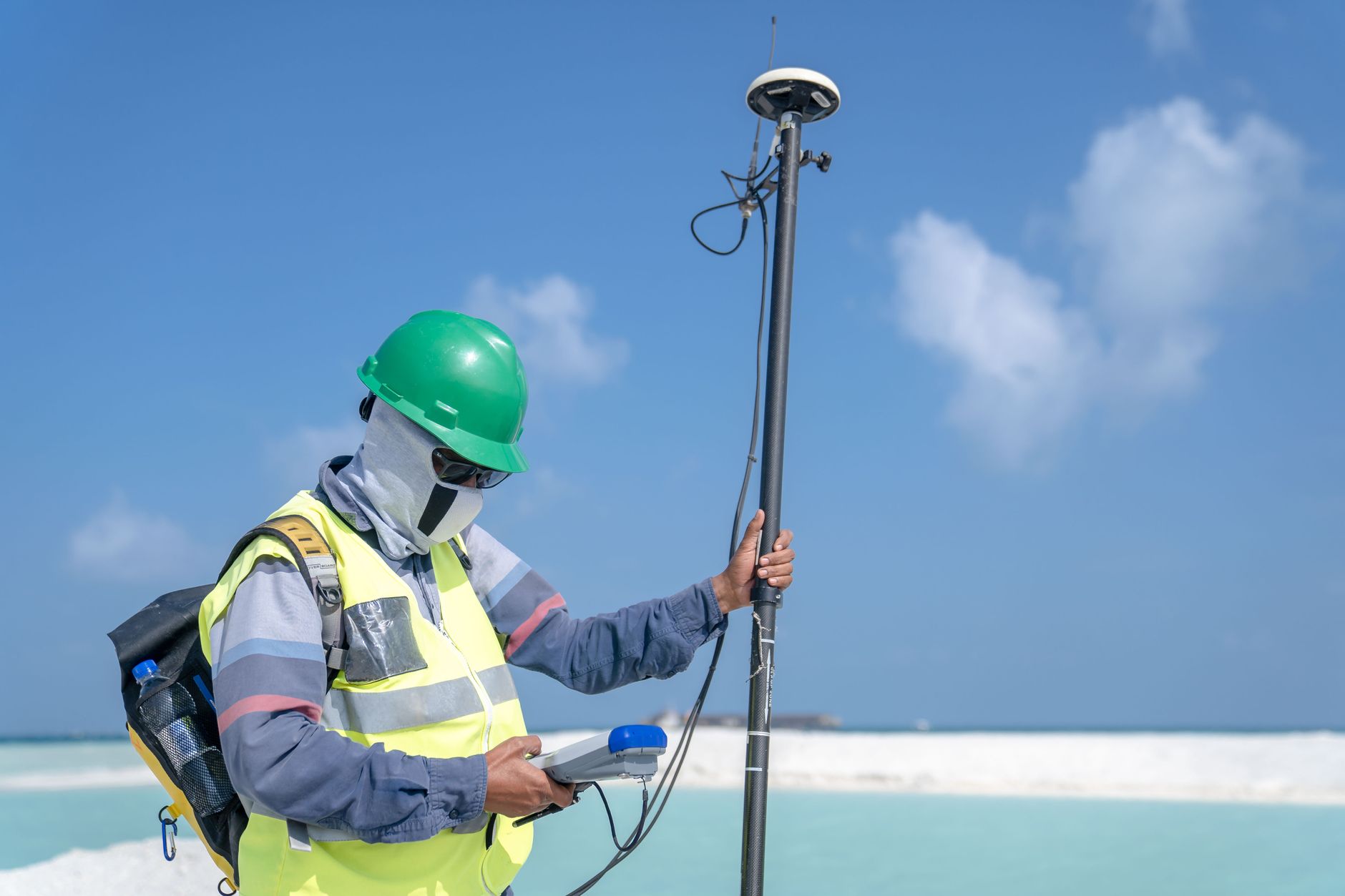 Licensed surveyor using GPS equipment on a Florida residential property