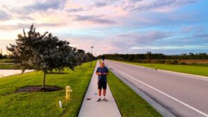 Home inspector at the entrance of a luxury Florida estate during a Florida pre-listing inspection